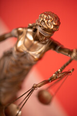 Bronze statue of the Goddess of Justice Themis, holding the Law Scales in her hands,