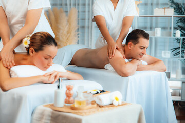 Caucasian couple customer enjoying relaxing anti-stress spa massage and pampering with beauty skin...