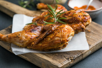 Whole roasted chicken rosemary. grilled barbecue delicious food on dining table at holiday celebrate