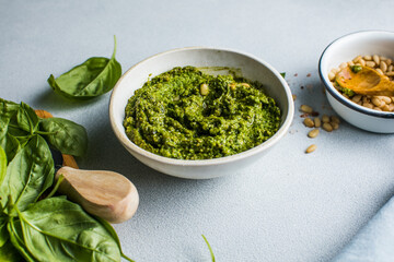 Pesto sauce and ingredients on white background, copy space.Food frame italian food background healthy food concept or ingredients for cooking pesto sauce on a vintage background top view with copy sp