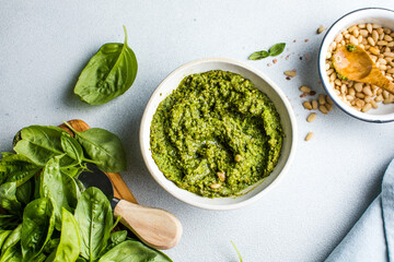 Pesto sauce and ingredients on white background, copy space.Food frame italian food background...