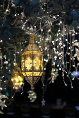 antique lampion and blinking drop lights for special holiday seasonal ramadan or valentine day decoration in a cafe or restaurant