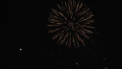 Golden fireworks that actually shine with bokeh lights in the night sky. Fiery fireworks display Fireworks celebration to bid farewell to the old year and welcome the new year