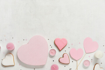 Paper hearts with sweet cookies and candles on white background. Valentine's Day celebration