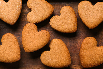 Tasty heart shaped cookies on wooden background. Valentine's Day celebration