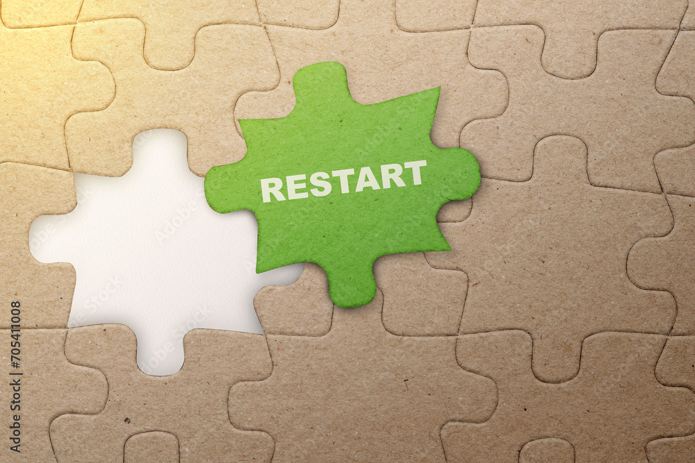 Poster piece of missing jigsaw puzzle with restart text
