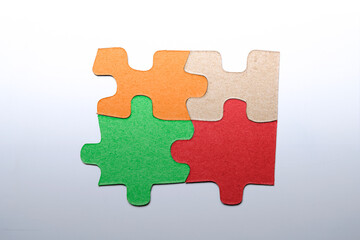 Fototapeta premium Closeup view of a jigsaw puzzle with colorful pieces