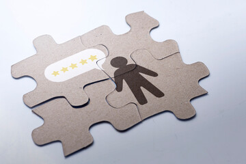 Jigsaw puzzle with the human figure and five-star rating