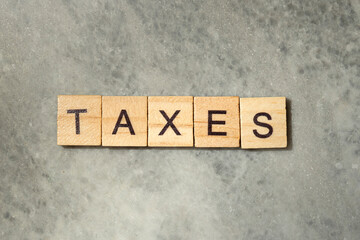 Wooden cubes with TAXES letters