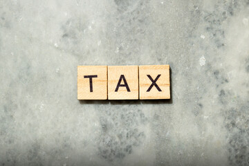 Wooden cubes with TAX letters