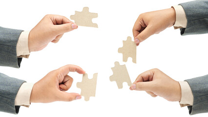 Collection of business hand holding a single piece of puzzle