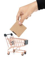 Business hand put a cardboard box on a shopping cart