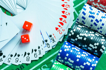 Gambling dice and poker cards in casino and casino chips poker table game business gambling concept	