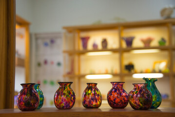 Glass vases on a shelf in a shop