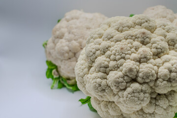 Close-up of farm fresh cauliflower against a blank background.