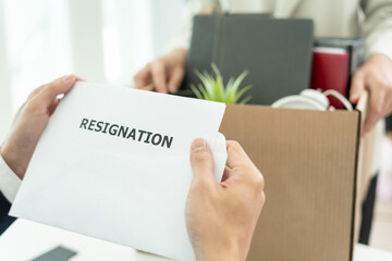 resignation, leave, quit, Business oner read resignation letter from employee. staff is lifting a brown paper box that holds personal items. , job placement and vacancies, resignation letter