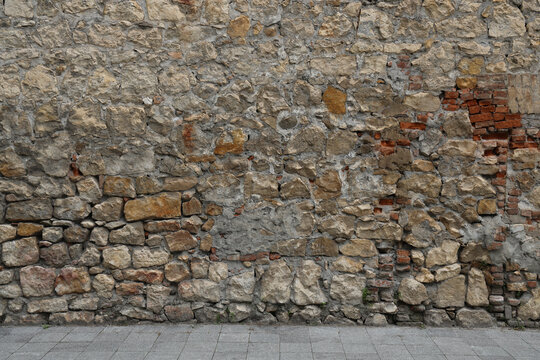 red brick, Stone wall texture. Texture of a stone wall. Old castle stone wall texture background. Rock Wall Texture, Rock Wall Backdrop. tiled grey granite floor.