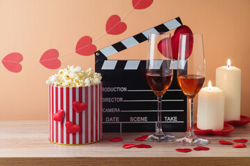 Happy Valentine's day and romantic movie concept with  movie clapper board, heart shapes, wine and...
