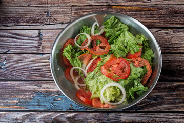 Vegetable salad on wooden table. Healthy food.