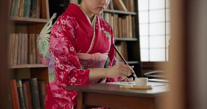 Woman, brush and ink for Asian writing or script with paper, document and creativity, calligraphy and traditional text. Japanese font, writer with black paint and person at desk with art and tools
