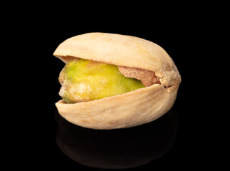 Fresh pistachio on a black background. Macro