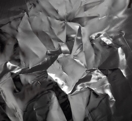 Black crumpled polyethylene as an abstract background. Texture