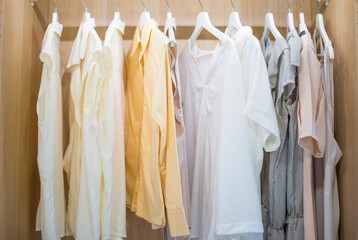 shirts on hangers inside wardrobe