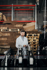 Engineer with tablet syncing machinery technology