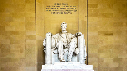 The statue of Abraham Lincoln sitting in a chair at the National Mall Memorial in Washington DC...