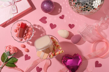 Valentine-related items such as balloons, are decorated against pink background. Valentine’s Day is a day when lovers express their affection with greetings and gifts