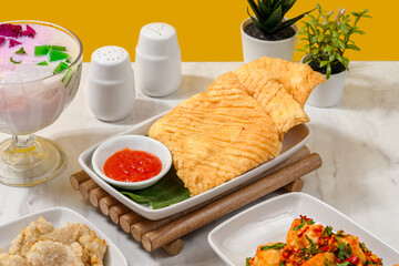 various types of food that are dipped in flour batter and then fried in lots of hot cooking oil.