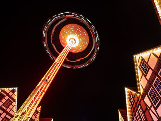 illuminated carousel in a city at night