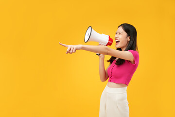 Photo of a young Asian woman wearing a pink t-shirt, holding a megaphone pointing forward, join us,...