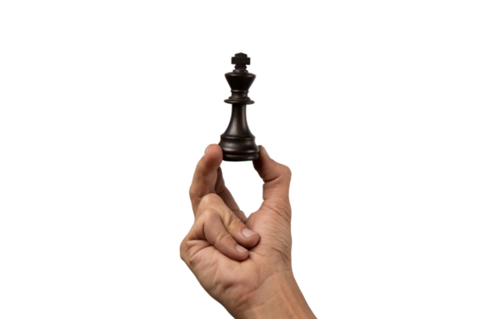 Male hand holding king chess figure isolated.