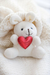 Cute bunny toy with red heart, home decoration with soft toys on bedroom for children and  nursery.