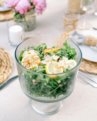 Tablescape with a refreshing summer salad made with lemons and arugula