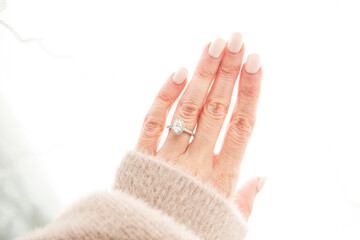 Oval Diamond Ring on Woman's Manicured Hand
