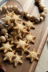 Snowflake cookies on a wooden board