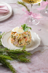 Russian salad with quail egg for the new year