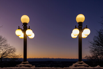 Pair of lamps glowing after sunset