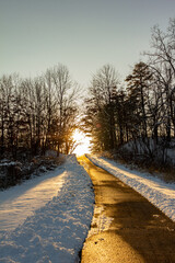 Path up a hill reflecting winter sunset