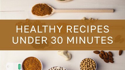 Healthy recipes under 30 minutes text on brown band over spices and ingredients on wooden worktop