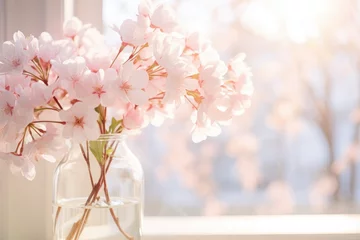 Rolgordijnen Bouquet of beautiful sakura flowers in vase on window sill © vassileva_t
