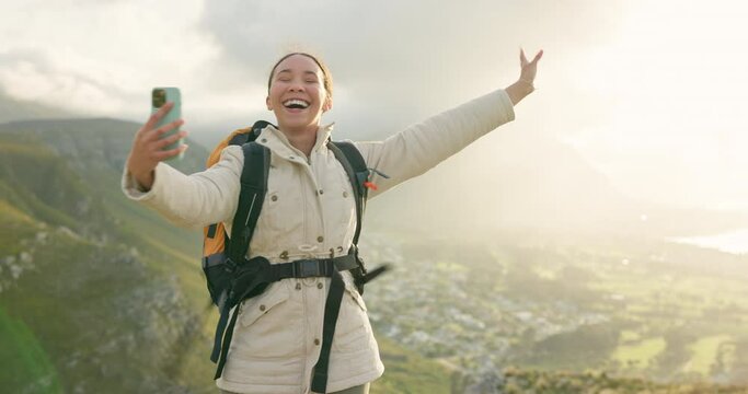 Woman, travel on mountains and video call for hiking, adventure and social media or eco friendly blog. Young influencer with freedom and excited in live stream on a hill, rock and nature for journey