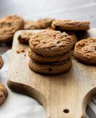Oatmeal cookies with pieces of chocolate. on a wooden background. snack