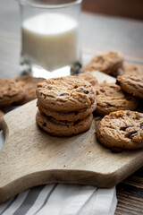 Oatmeal cookies with pieces of chocolate. on a wooden background. snack