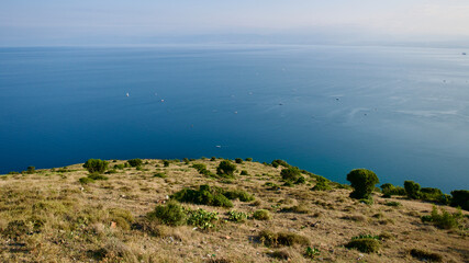 Northern Türkiye, Black Sea off the coast of Sinop. View of the Black Sea from the rocky mountain peak. Skyline, sea and rocky hill.