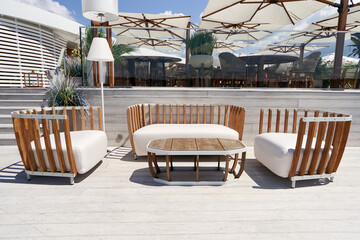 Luxury outdoor upholstered furniture on the terrace on a sunny day