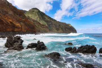 Black rock in the waters off the coast of the island of Madeira, Portugal. Not far from the town of Porto Moniz