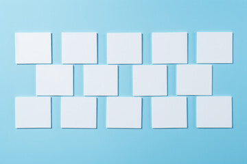 Obraz premium Blue background with blank white letterhead ideal for advertising or presentations with ample copy space.